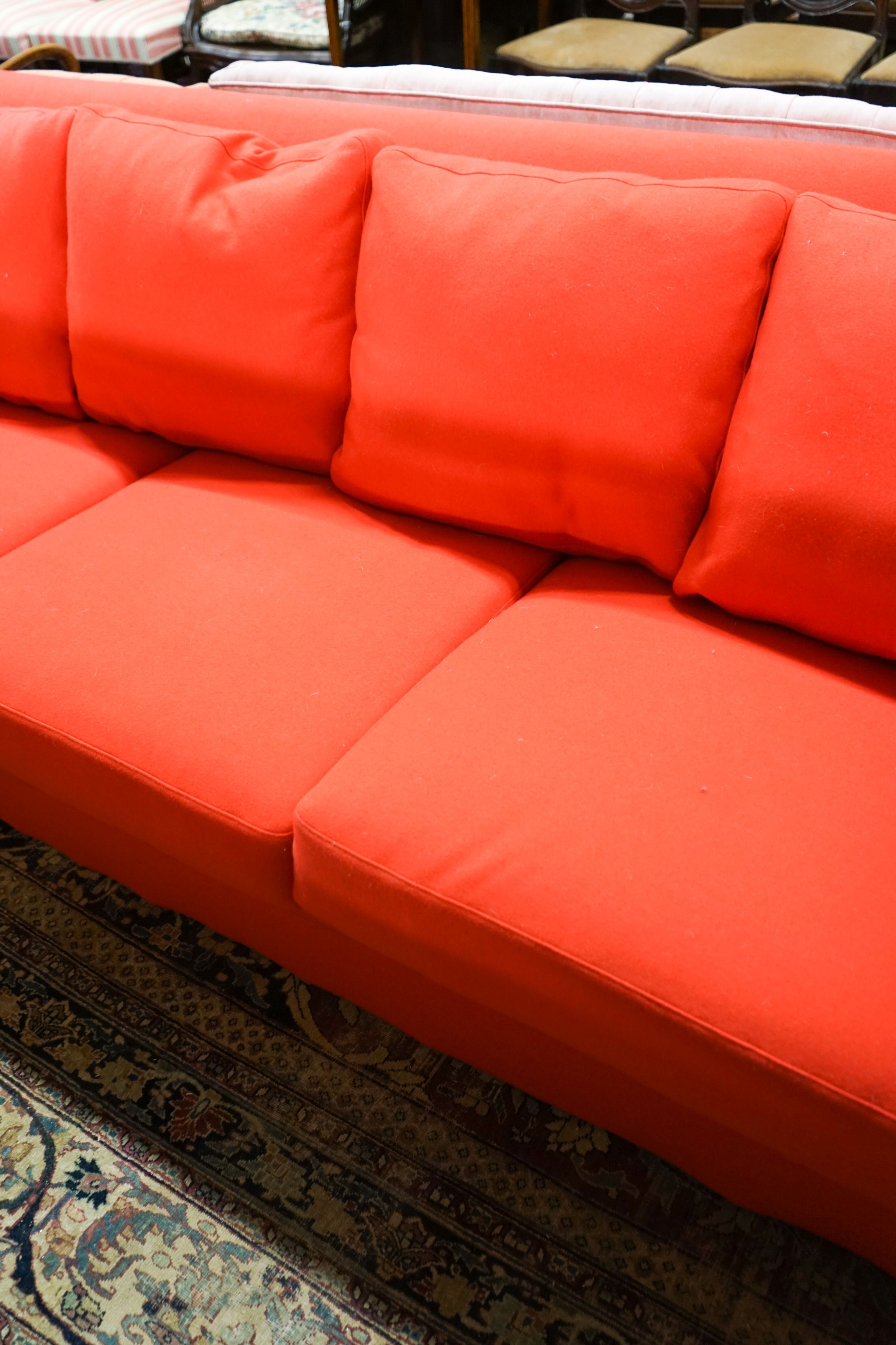 A contemporary Moroso three seater and two seater sofa upholstered in red fabric, the larger length 250cm, depth 100cm, height 79cm